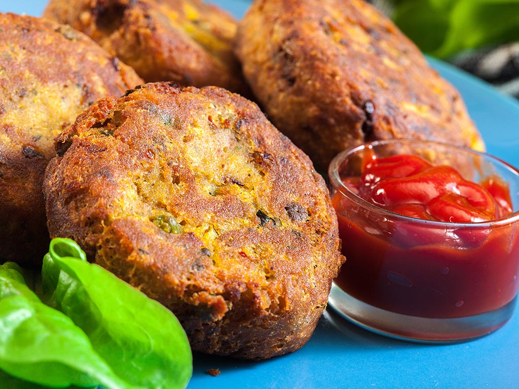 Mini Potato Patties. 6 delicious hand made potato cheese patties mixed with chopped vegetables and lightly fried and served with creamy siracha sauce